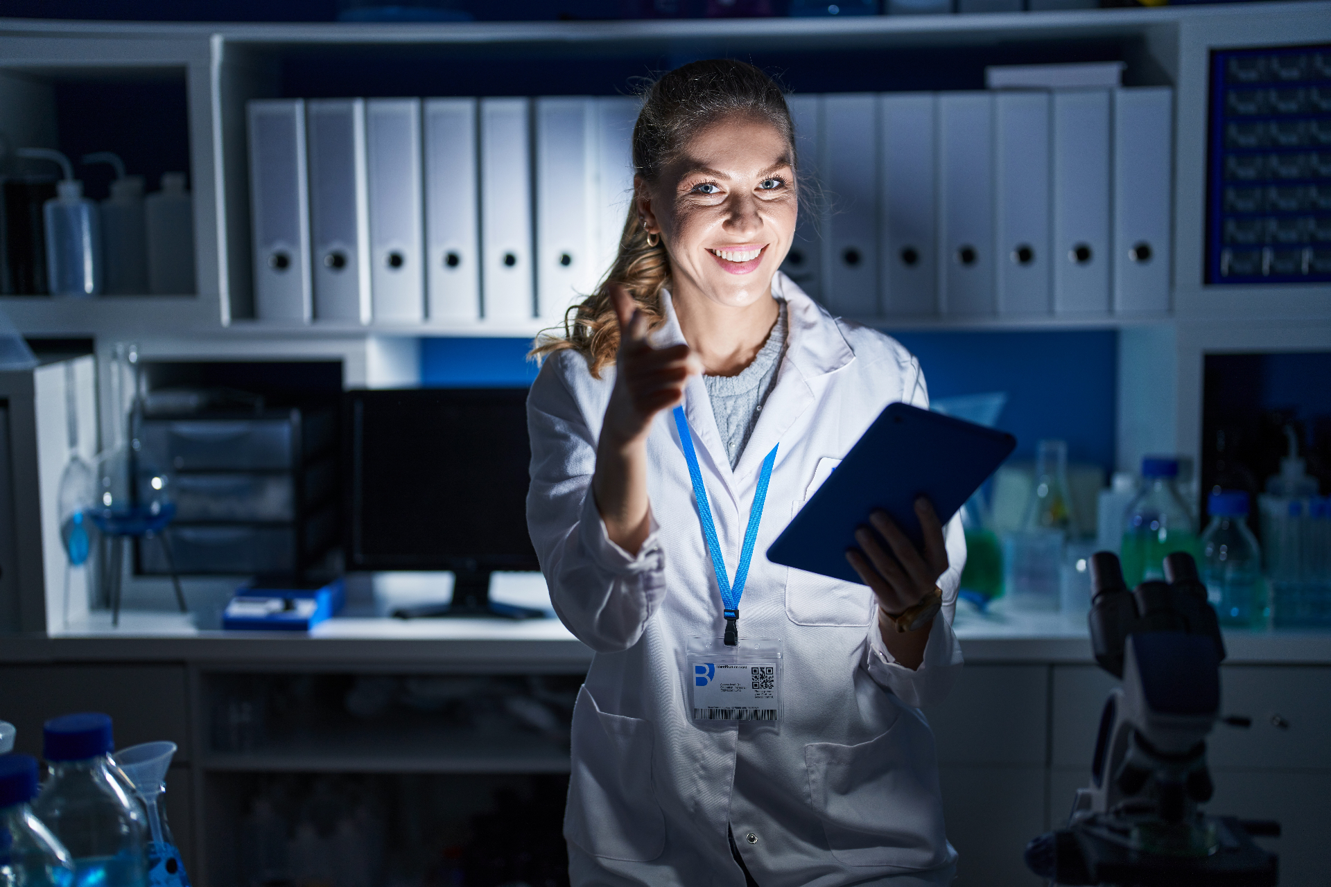 A scientist smiles from a dim lab, gesturing you closer — Dr. Light awaits.
